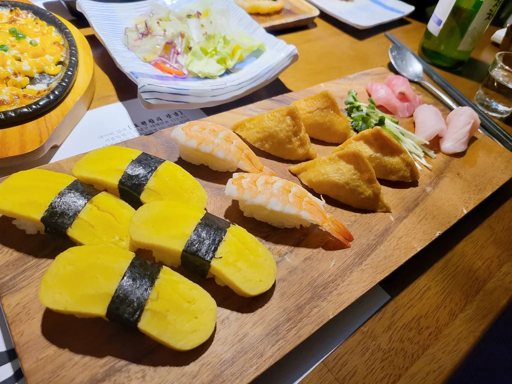 Business photo featuring tamago, inari, and shrimp sushi at Dowon Tuna